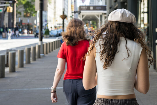 Two People Walking on New York City Sidewalk