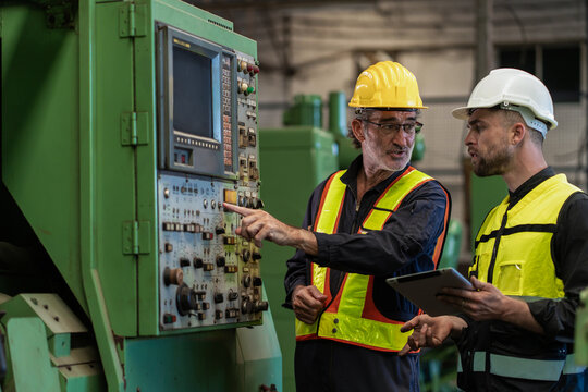Workers Factory or Engineering work at factory site check up machine or products in site. Foreman or Technician checking Material or Machine on Plant. Heavy industry factory concept.