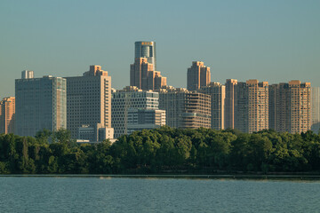 Modern urban skyline with lakeside park and high rise buildings © TrinhBaoTran