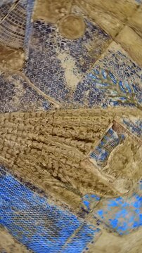 Ceiling relief inside the Dendera Temple Complex featuring ancient astronomical symbols and blue-painted carvings that reflect the sacred cosmic beliefs of Ancient Egypt.