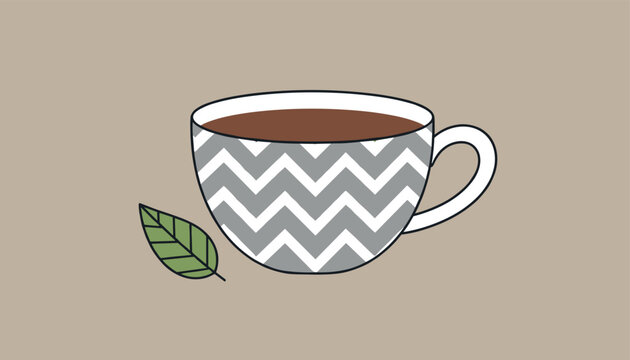 Ceramic tea cup with a trendy gray chevron zigzag pattern holding warm dark brown tea with a single green leaf beside it.