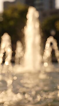 A Glimmering Fountain Display Captured in Two Frames, Showcasing Water Dancing in Sunlight and Creating a Mystical Atmosphere of Beauty and Serenity