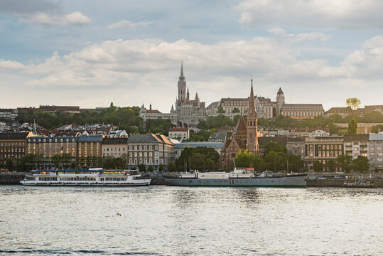 Scenic view of Buda Castle hill with St Matthias Church and Fisherman's Bastion across the Danube river in Budapest