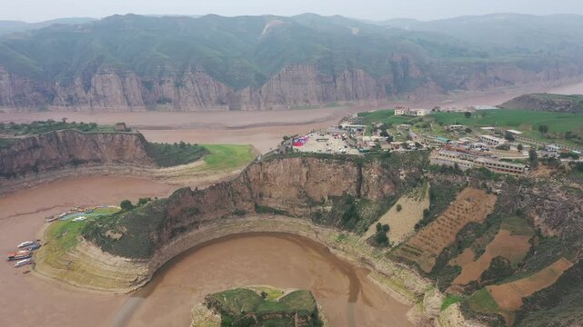 Circular Yellow River Omega Bend With Canyon Cliffs And Boats Inner Mongolia 01