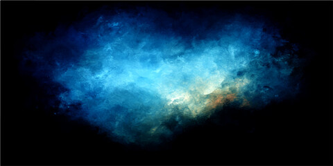 Abstract blue and gold smoke swirling in darkness creating a cosmic nebula effect with light and shadow. © Zìyóu