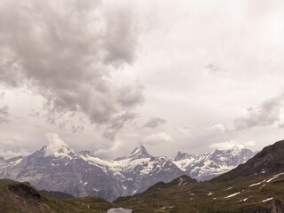 Obraz premium mountain road in the mountains, clouds over the mountains, lake in the mountains