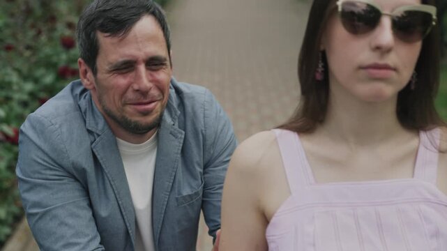 Weak man begging his girlfriend not to leave him