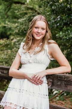 Portrait of a teen girl leaning on fence