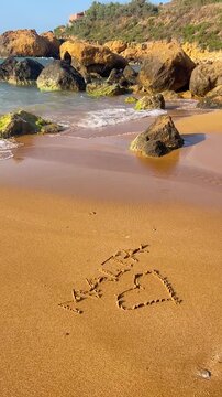 Malta Written in the Sand with a Heart on Ramla Bay Beach, Gozo
