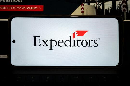 Expeditors company logo on a mobile device showing global logistics