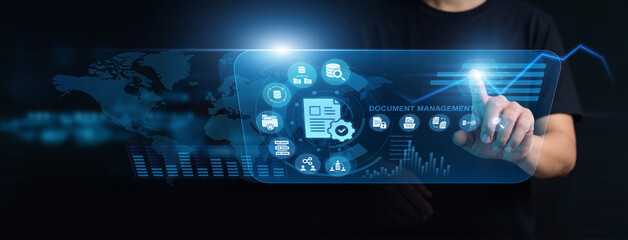 Fototapeta premium Records administrator using modern interface for document management. Specialist organizing secure corporate folders, assigning user permissions, and tracking version histories smoothly.