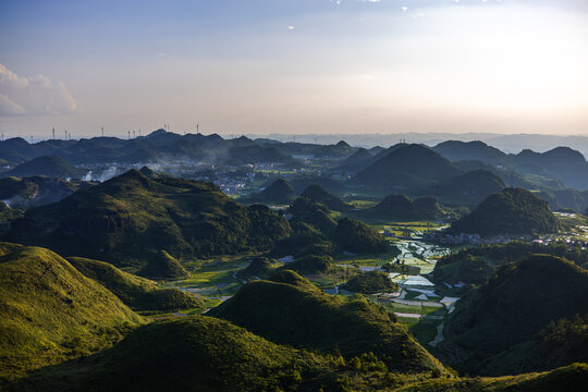 Sunlit Karst Mountains and Rice Fields in a Rural Valley