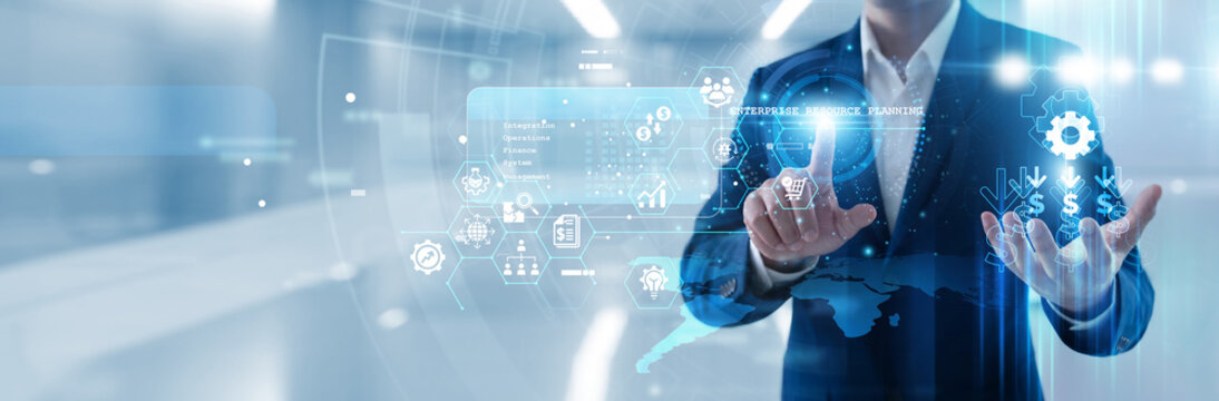 Business manager hand touching enterprise resource planning interface to integrate core processes, manage supply chains and centralize data for efficient corporate resource management today.