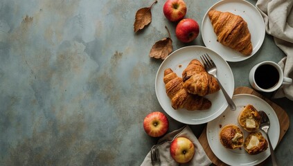 Fototapeta premium Freshly Baked Croissants and Apples on a Table With a Cup of Coffee in a Cozy Kitchen Setting