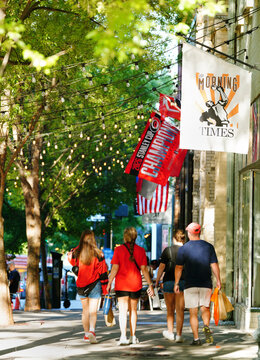 Raleigh, NC - USA - 6-20-2026: Fans walking in downtown Raleigh after the Carolina Hurricanes NHL Stanley Cup victory parade in downtown Raleigh