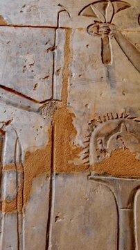 Close-up of detailed hieroglyphic rows with cartouches carved in stone lintel at
