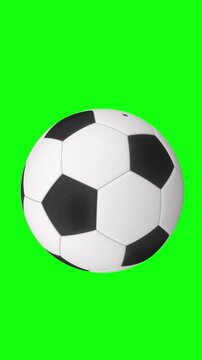 Rotating Soccer Ball Falling Down On Bright Green Chroma Key Background