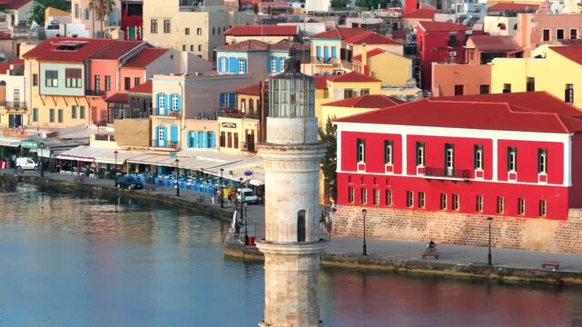  View of Chania with the amazing lighthouse, mosque, venetian shipyards, Crete, Greece.Waves crashing on lighthouse, Beautiful Greece and best scenic places - panorama