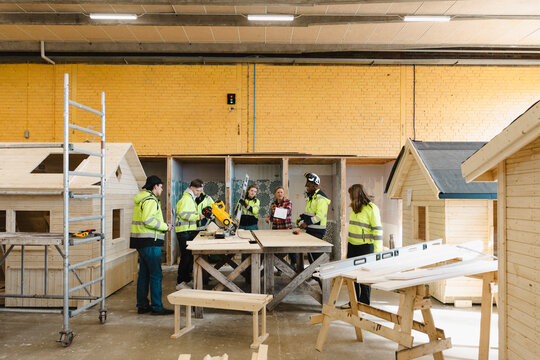 Group of young vocational students at construction training workshop in high school