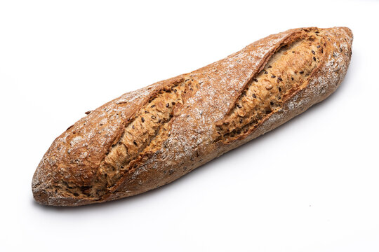 Freshly baked rustic bread baguette with seeds isolated on white background