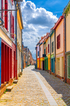 Colorful houses of Amiens historical city centre Saint-Leu quarter. Narrow cobblestone cozy street with multicolored bright walls of buildings, Somme department, Hauts-de-France Region, France