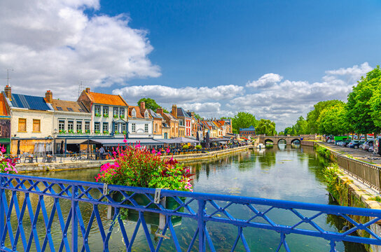 Amiens old town Saint-Leu quarter, embankment promenade of Somme river with street restaurants and cafe, typical houses and bridge in historical city centre, France landmarks, Hauts-de-France Region