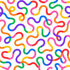 Fototapeta premium Vibrant rainbow colored wavy lines forming a playful abstract seamless pattern