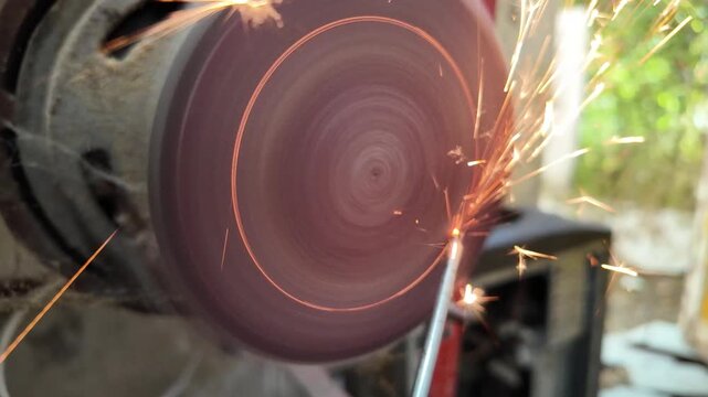 Close-up view of sharpening. 4K Metal Spark.