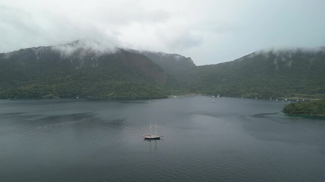 Big sailing boat anchored in the calm bay