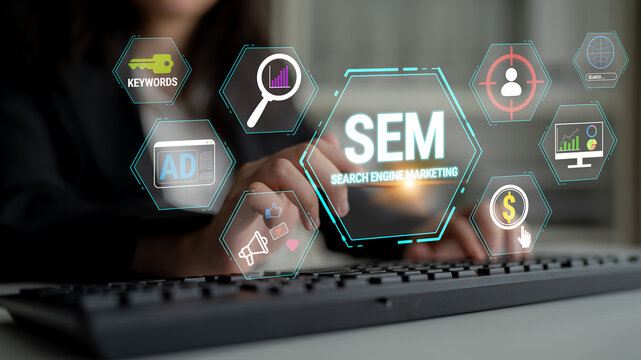 Professional woman using laptop for search engine marketing with digital icons depicting analytics, advertising strategies, and keywords in office environment Fluxor.