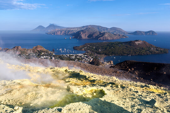 Panoramic view from Vulcano island crater with yellow sulfur fumaroles looking at Lipari Italy