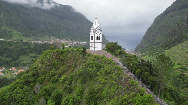 Slow aerial push-in towards Capelinha de Nossa Senhora de Fatima chapel in Madeira