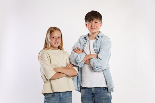 Portrait of brother and sister on white background