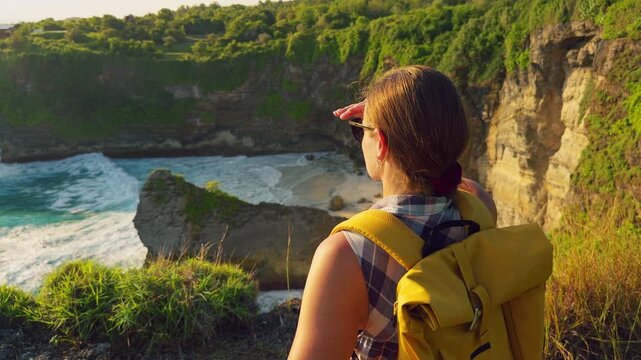 Female Traveler Looking Across Hidden Beach and Coastal Cliffs From Scenic Viewpoint at Korawa Beach in Slow Motion