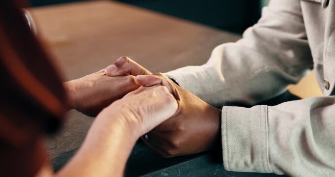 Holding hands, bonding and couple in home with comfort, love and connection in marriage. Care, console and man with woman for assurance, partnership or commitment in relationship together at house.