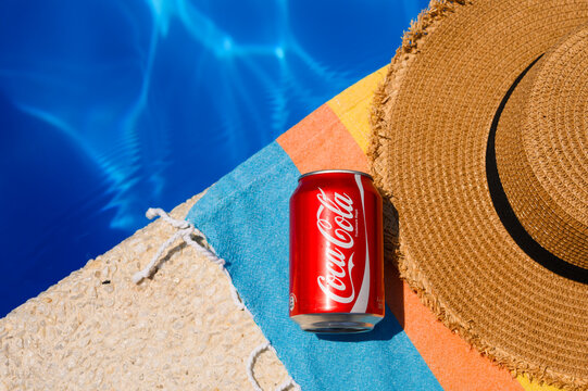 Anapa, Russia - July 14, 2025: can of Coca-Cola near a hotel pool. A refreshing drink on a summer day