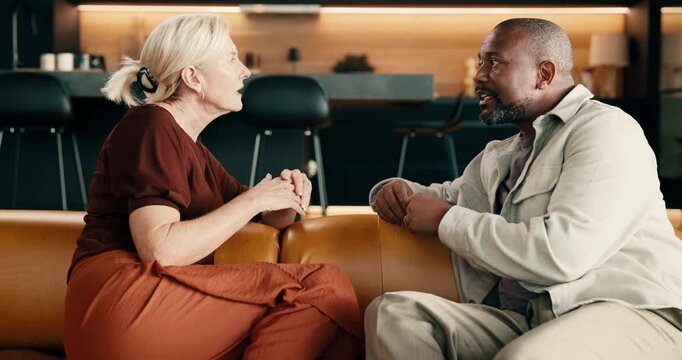 Argument, conflict or interracial couple in home, fight or relationship mistake with infidelity dispute. Disagreement, mature man and woman in living room, marriage problem or conversation on sofa