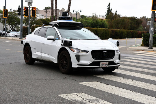 Los Angeles, California &ndash; July 1, 2026: Waymo Jaguar I-PACE autonomous self-driving vehicle operating on a public street 
