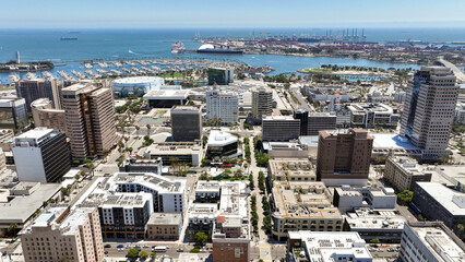 Long Beach, California, USA - Aerial Drone View of Downtown Long Beach Skyline, Rainbow Harbor, Shoreline Marina, and the Port of Long Beach © Daniel