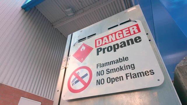 Danger propane warning sign on metal fuel storage locker