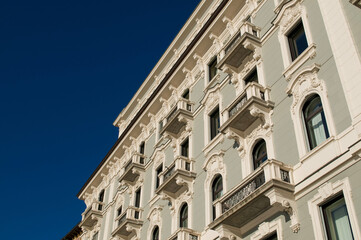 Obraz premium Elegant historic building facade in Via Nassa Lugano under blue sky