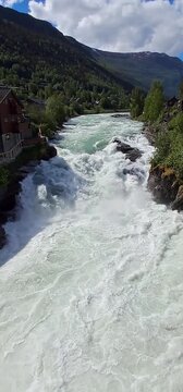 Bovra River waterfall cascading into the Otta River in Lom, Norway
