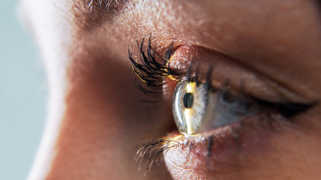 Close-up of a female eye during a slit lamp ophthalmic examination. Concept vision diagnostics, eye health and modern ophthalmology.
