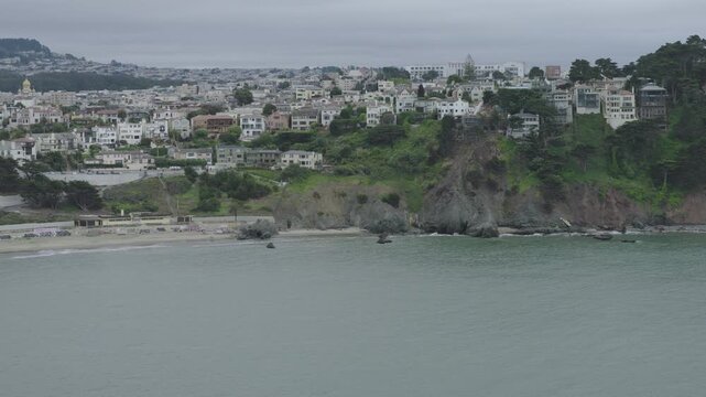 Coastal Cliff Residential Neighborhood Above Rocky Beach In San Francisco - Aerial Shot