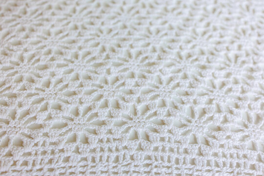 White crochet lace textile texture handmade pattern close up
