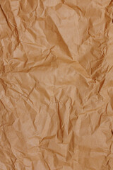 Fototapeta premium Crumpled kraft paper background with natural recycled paper texture