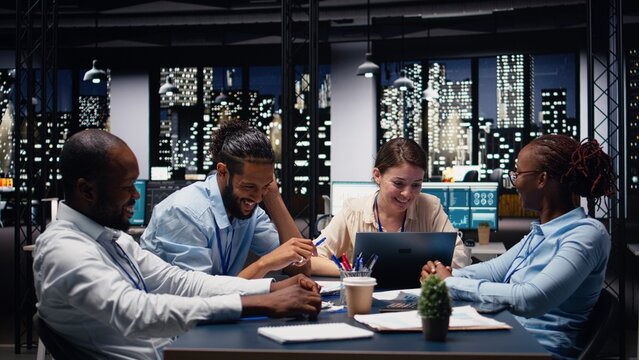 Diverse team sharing a high five and celebrating accomplishment in office together, dream team ensures efficient collaboration and problem-solving concept.