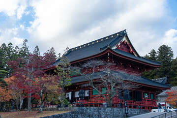 Fototapeta premium Rinnoji Temple Sanbutsudo Hall Surrounded by Autumn Foliage in Nikko Japan