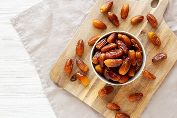 Fototapeta premium Algerian Dates Deglet Nour in a Bowl, top view. Copy space.