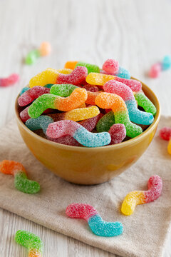 Sugary Sour Gummy Worms in a Bowl, side view.